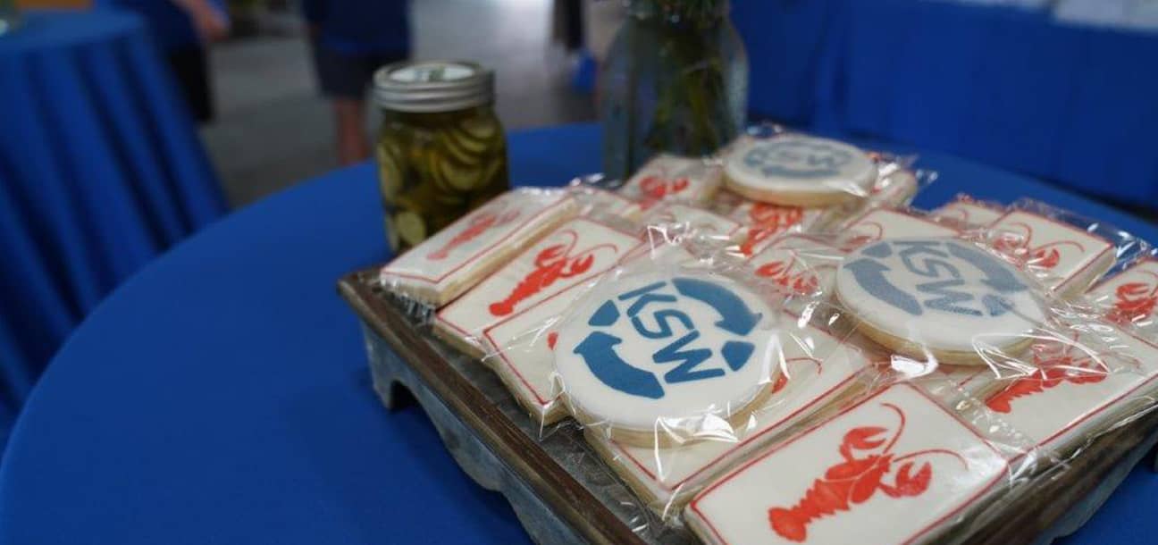 Arrangement of cookies with KSW logo and crawfish icing